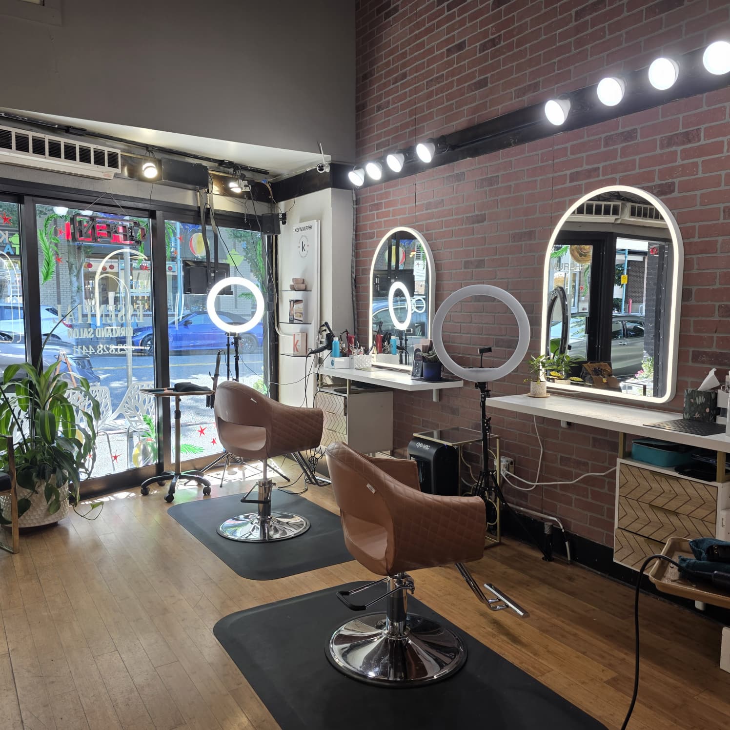 Luxury beauty salon interior with modern styling stations and elegant décor