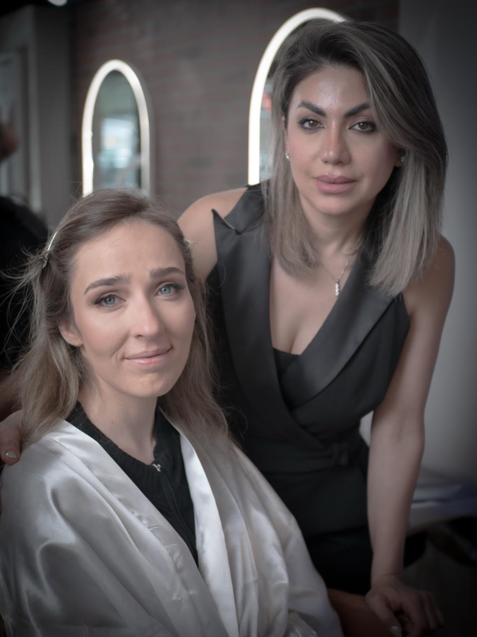 Beautiful woman with professional makeup and sleek hairstyle transformation