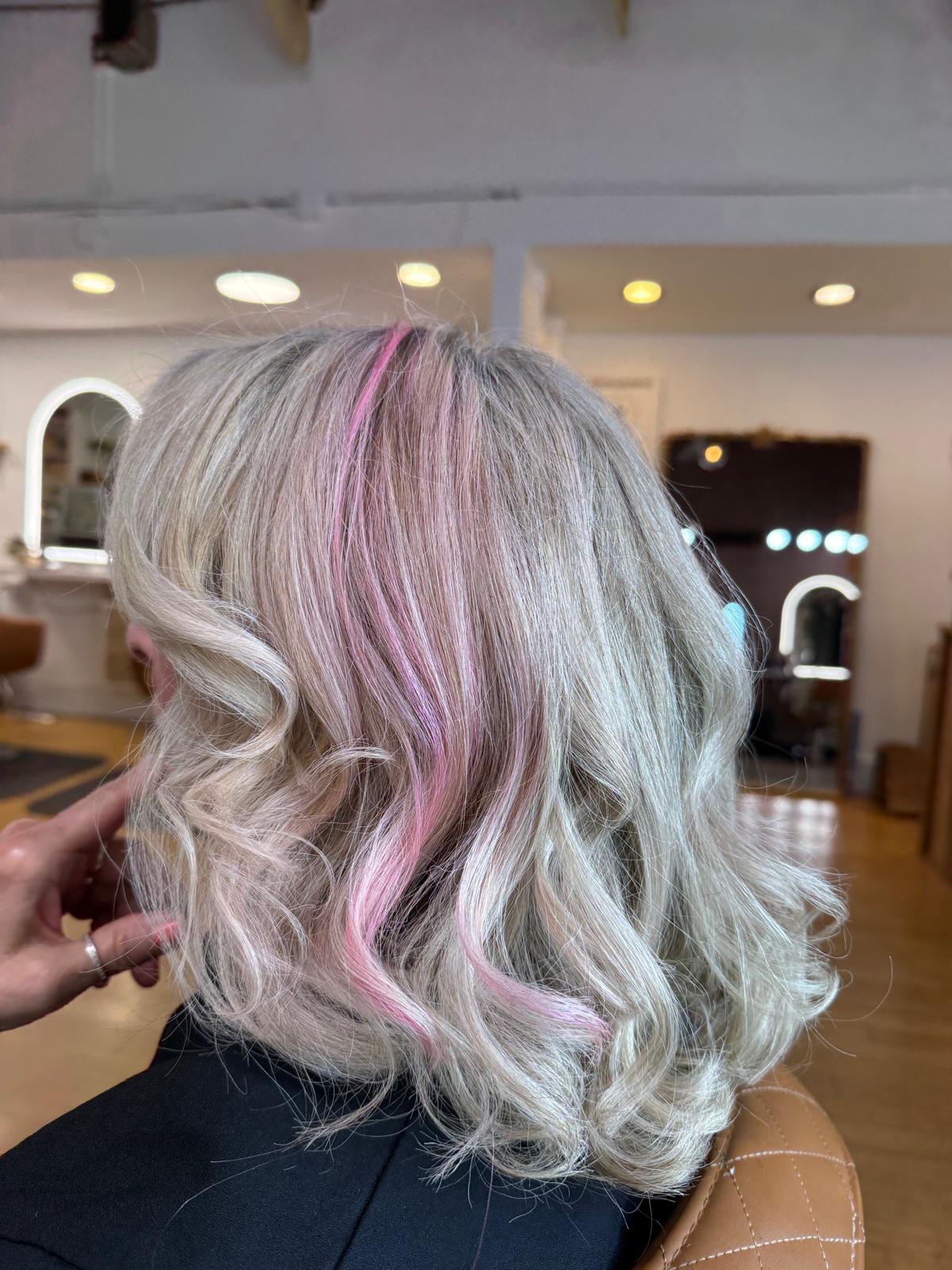 Beautiful woman with professional makeup and sleek hairstyle transformation