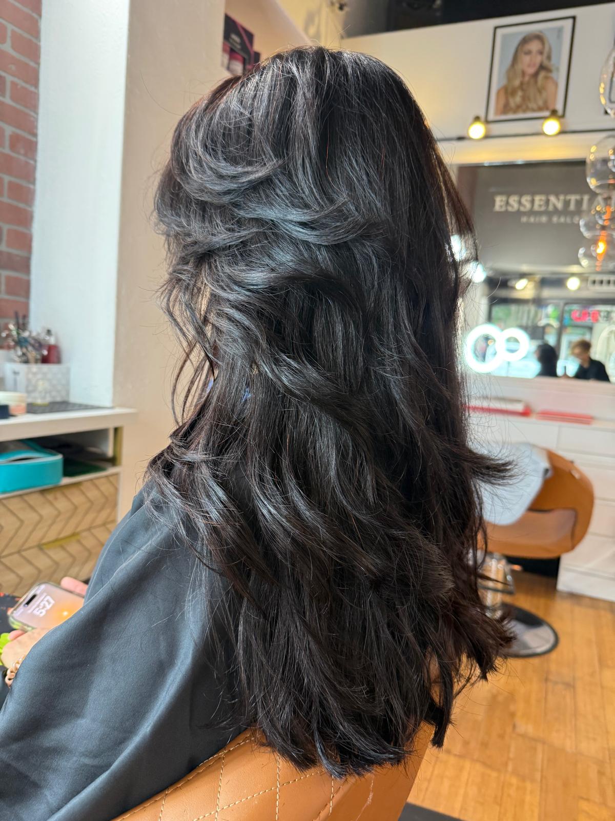 Beautiful woman with professional makeup and sleek hairstyle transformation