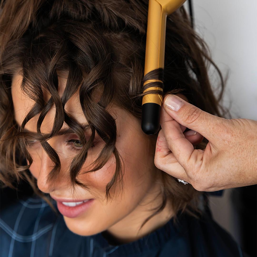 Beautiful woman with professional makeup and sleek hairstyle transformation